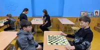 Гимназическая спартакиада по шашкам: стратегия, ум и азарт!